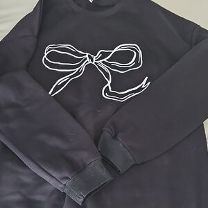 Black Sweatshirt with White Bow Design